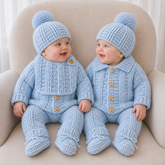 Babies on a cream chair wear Zeb crochet sets with cardigans, hats, pants and booties; one wears a bib. Digital pattern PDF.
