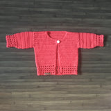 Coral crochet baby sweater