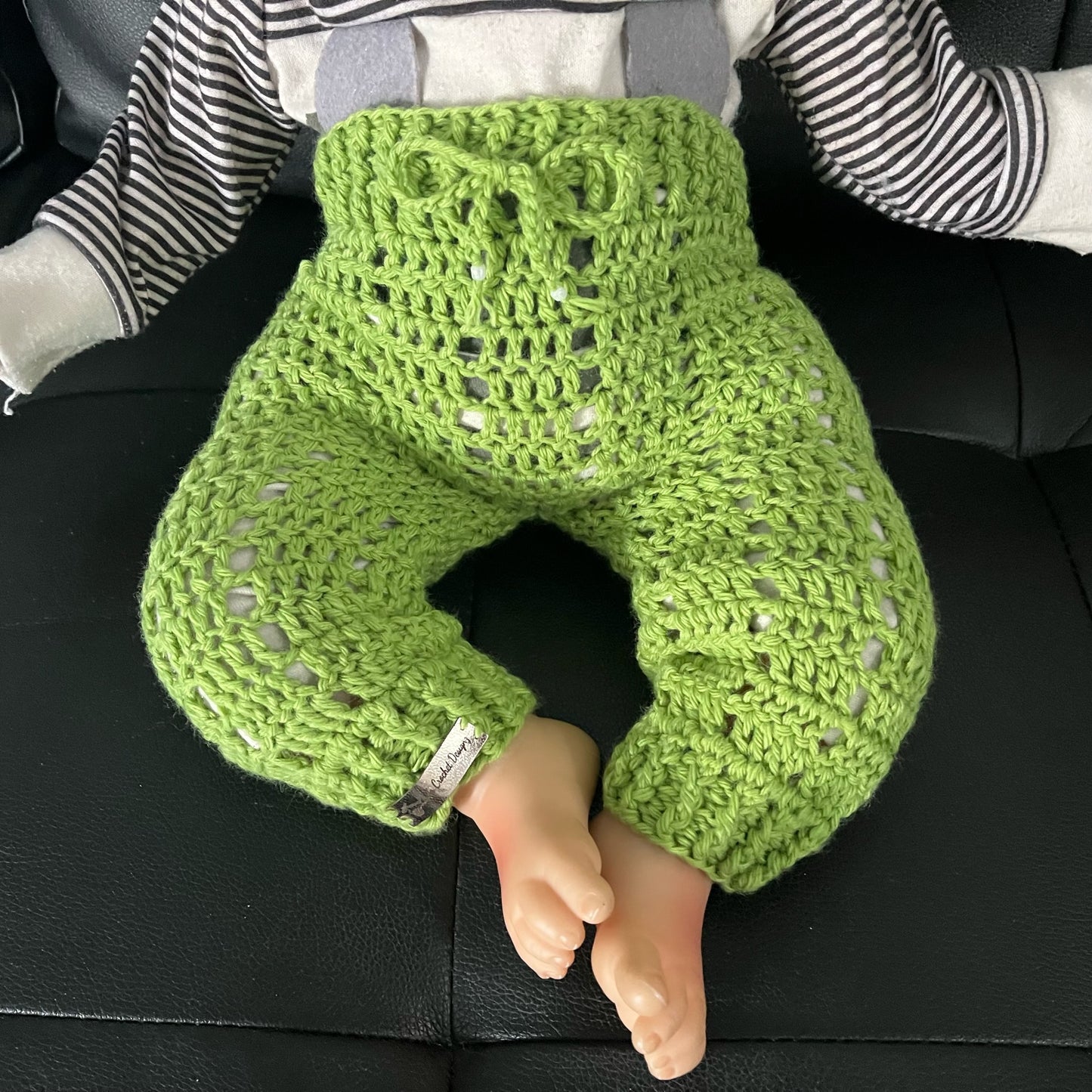 Apple crochet baby pants on baby