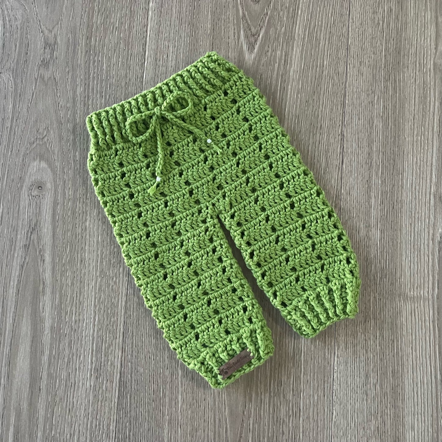 Apple crochet baby pants front slant left