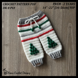 Chrissy Christmas crochet baby pants flat lay on wood, showing digital pattern PDF details, sizes Preemie to 2 Years.