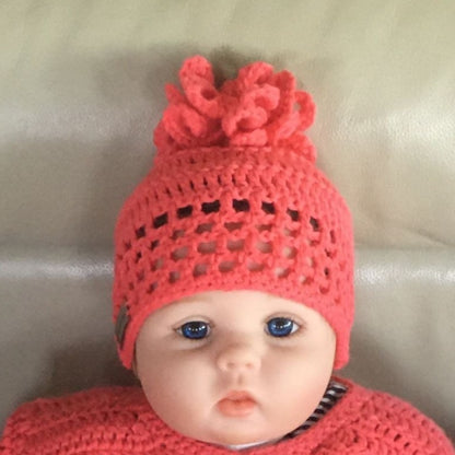 coral crochet hat on baby