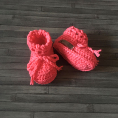 Coral Crochet Baby Booties one bootie lying down