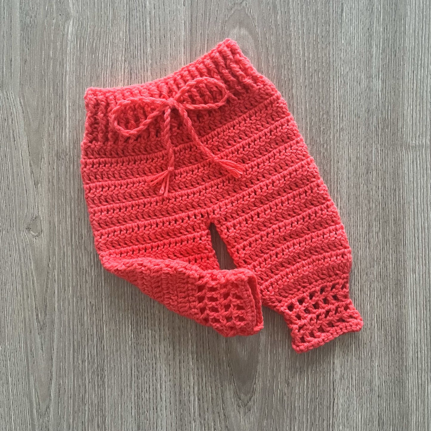 Coral Crochet Baby one leg kicking