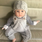 hugo baby romper and hat set on baby