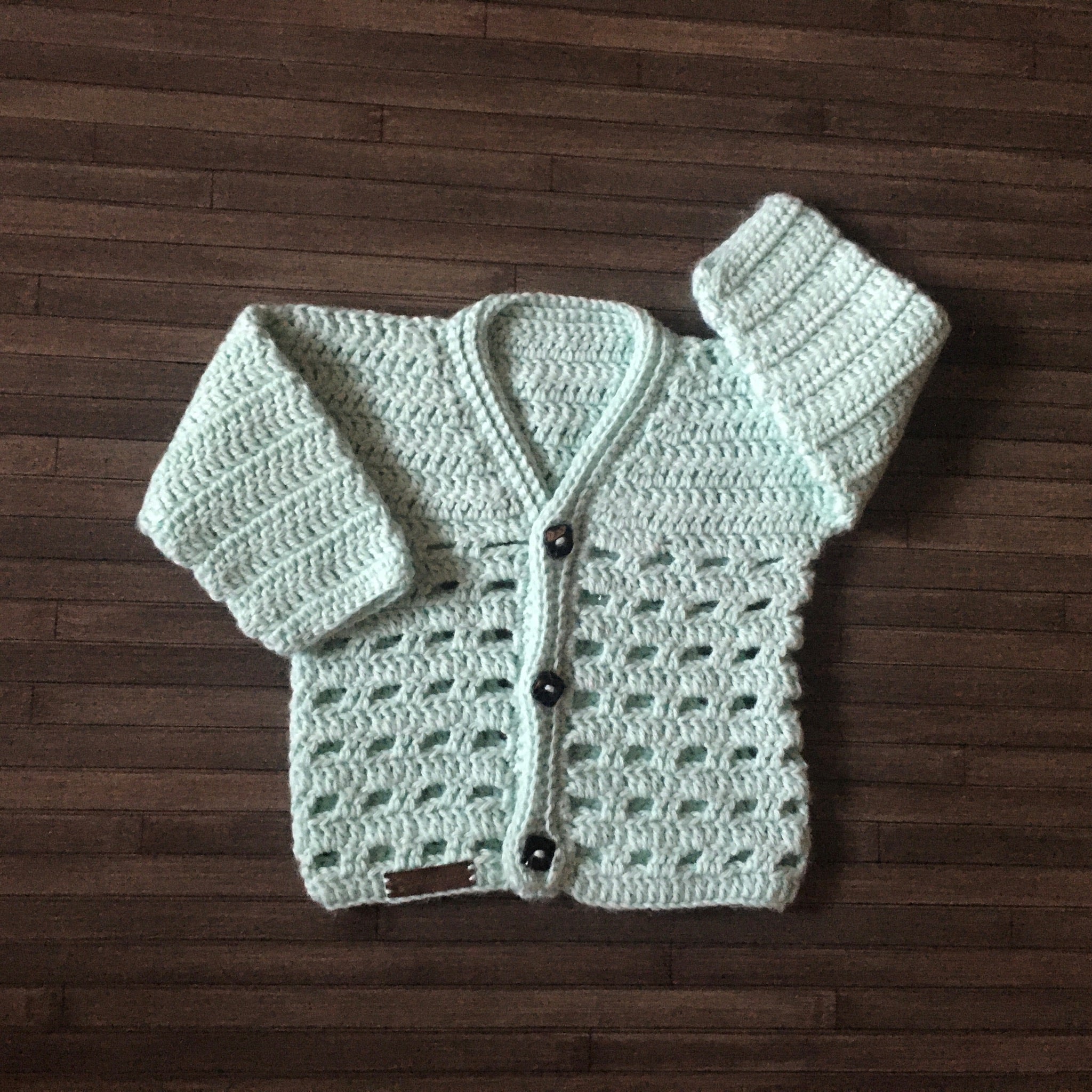 Adam crochet baby sweater one arm up one arm down