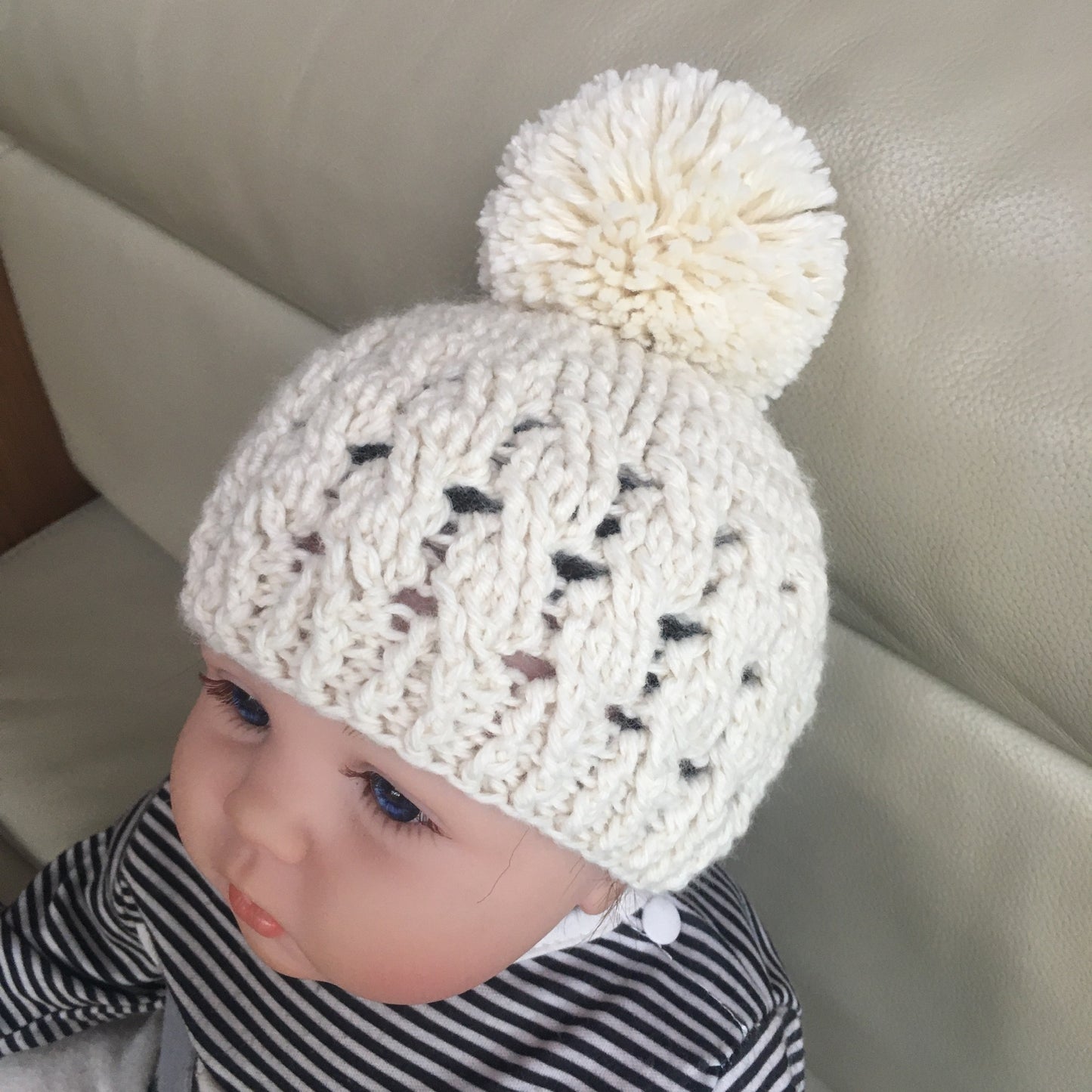 caleb crochet cabled hat on baby right side