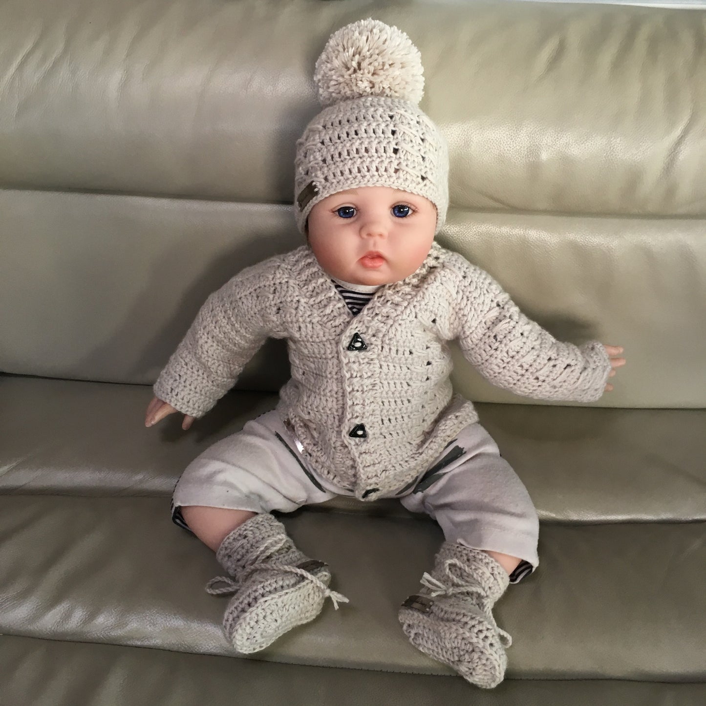 Carter crochet sweater hat and booties on baby